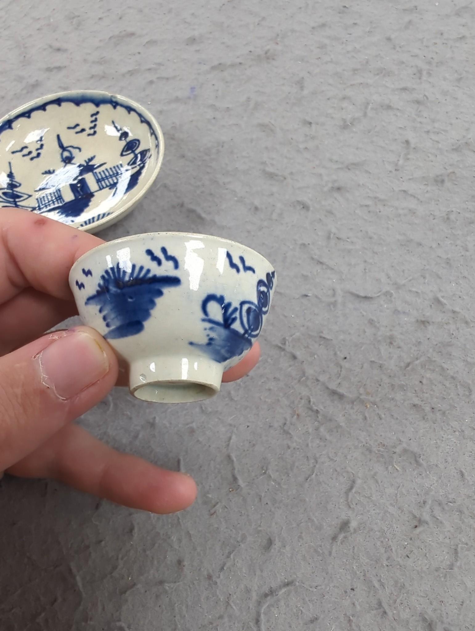 A late 18th century pearlware blue and white miniature jug, 5cm, and tea bowl and an English porcelain miniature mug, late 18th century